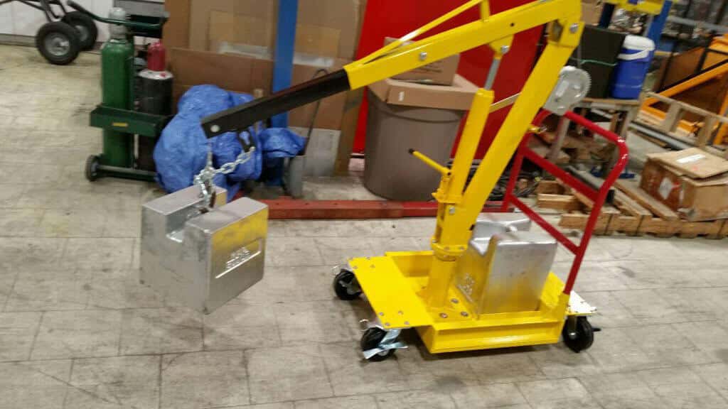 A portable custom lift moves a heavy item.