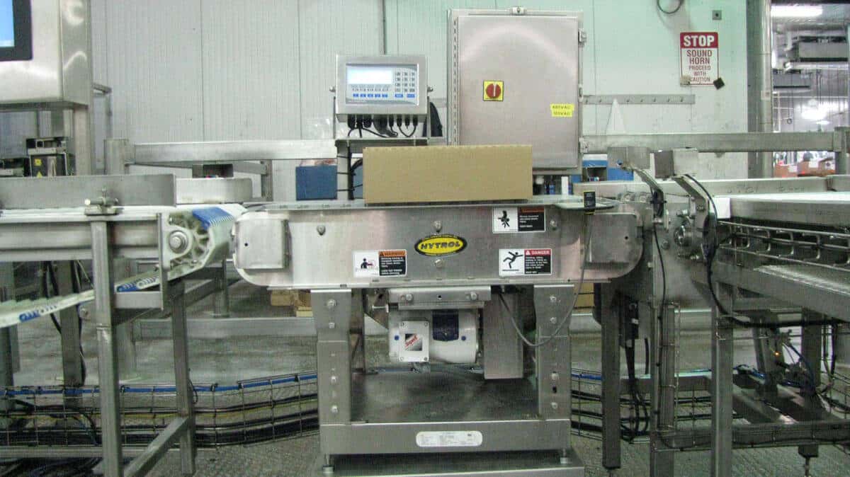 A custom system including an Avery Weigh-Tronix E1310 programmable indicator, Diamond Series bench scale base and Hytrol conveyor.