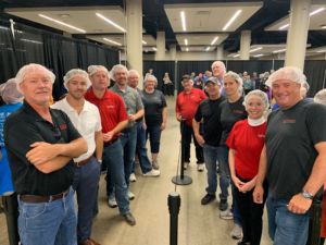 RMH employees are shown volunteering at a food bank.