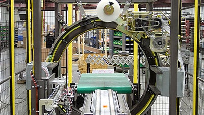 An Orbital stretch wrapping system is shown on a production line.