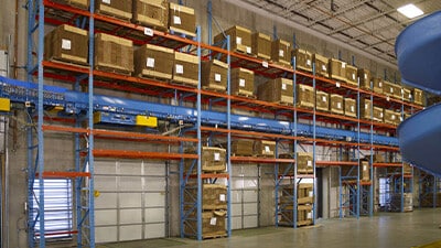 An OverDock rack and storage system is shown in a warehouse.