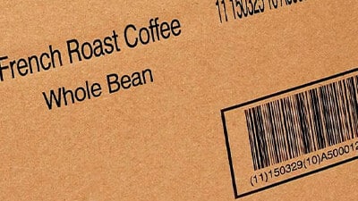 Labeling information for coffee beans is shown on a carton.