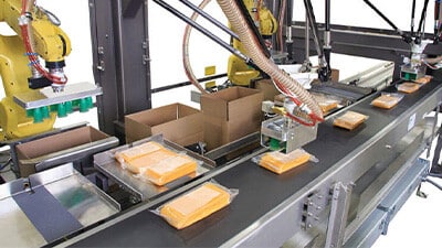 Pick and place packing on a conveyor line.