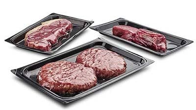 Steaks and burgers are shown in blister skin packaging.