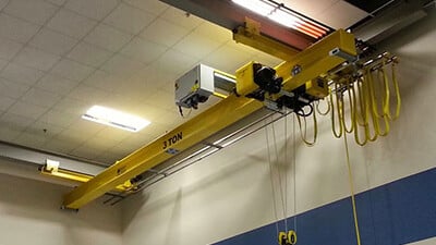 A 3-ton underhung crane is shown inside a facility.