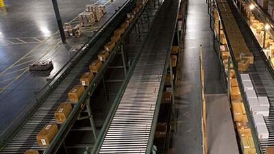 A zero pressure conveyor is shown in a warehouse.