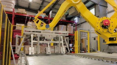 Robotic case palletizer in a warehouse