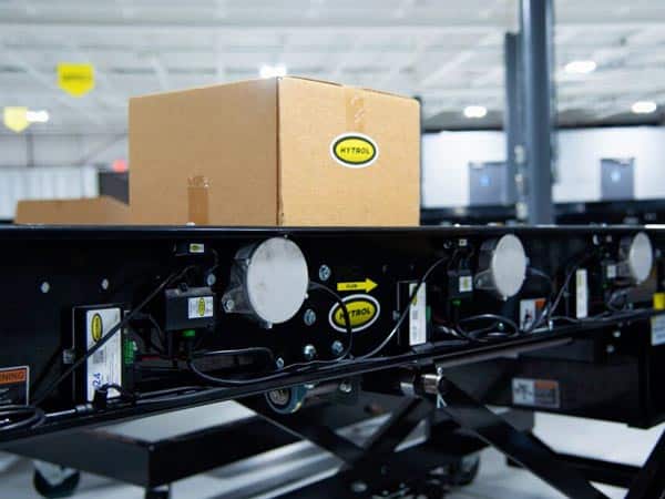 A carton moves across a 24-volt zero-pressure conveyor.