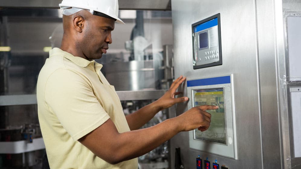 Man using liquid fill machine